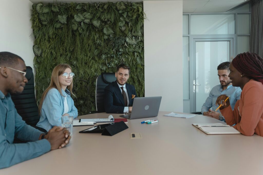 Executives sitting around a boardroom table having a meeting